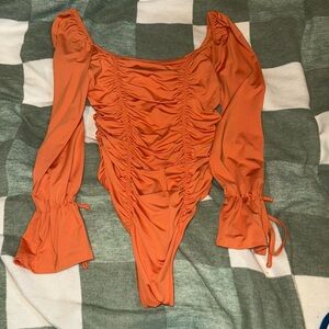 Orange bodysuit